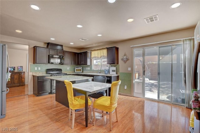 9065 W Torino Ave, Las Vegas, NV 89148 - dining space featuring light wood-style flooring and recessed lighting