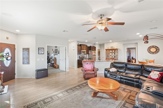 2720 Mickey Mantle Ct, Las Vegas, NV 89108 - living area featuring ceiling fan, light wood finished floors, recessed lighting, and baseboards