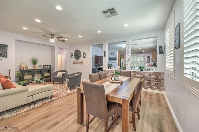 dining room featuring recessed lighting, light wood-style floors, baseboards, and a ceiling fan