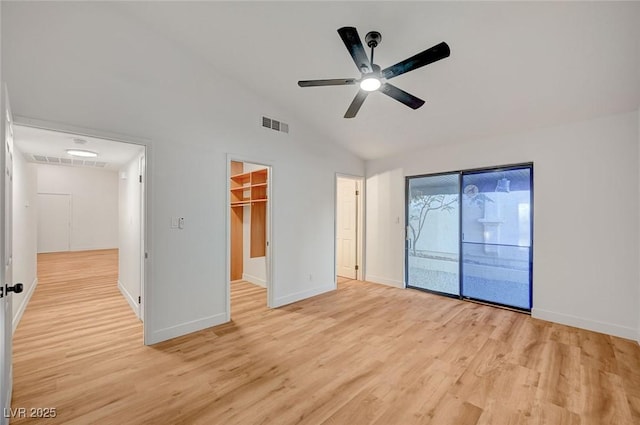 8412 Mulcahy Ave, Las Vegas, NV 89145 - unfurnished bedroom with light wood finished floors, vaulted ceiling, access to exterior, baseboards, and a spacious closet