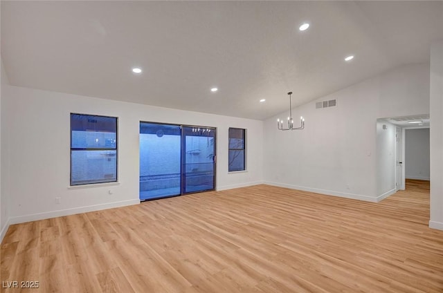 8412 Mulcahy Ave, Las Vegas, NV 89145 - spare room with lofted ceiling, a chandelier, light wood finished floors, recessed lighting, and baseboards