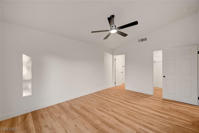 8412 Mulcahy Ave, Las Vegas, NV 89145 - unfurnished bedroom with lofted ceiling, light wood-type flooring, baseboards, a spacious closet, and a ceiling fan