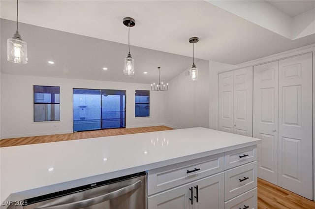 8412 Mulcahy Ave, Las Vegas, NV 89145 - kitchen featuring light wood-style floors, pendant lighting, recessed lighting, light countertops, and stainless steel dishwasher