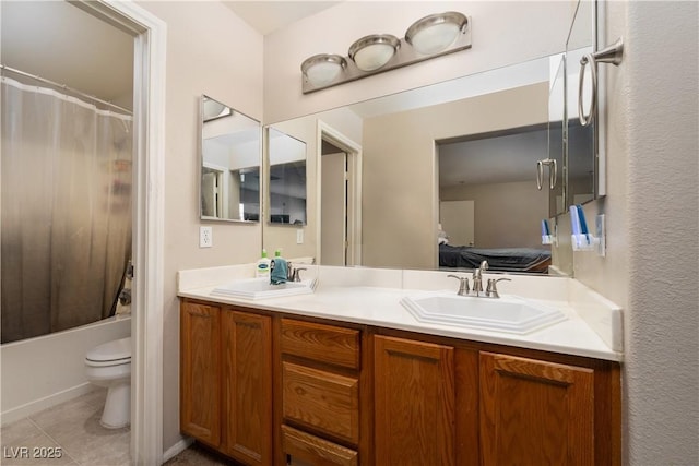 3120 Inlet Bay Ave, North Las Vegas, NV 89031 - ensuite bathroom featuring double vanity, toilet, tile patterned floors, and shower / bath combo with shower curtain