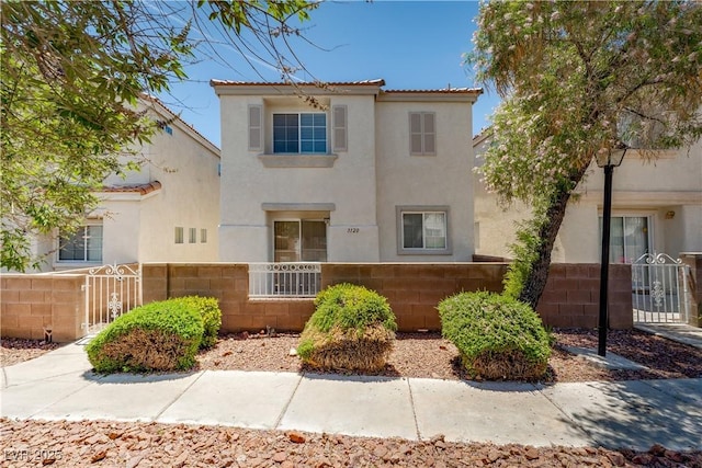 3120 Inlet Bay Ave, North Las Vegas, NV 89031 - view of front of house featuring a fenced front yard, stucco siding, a gate, and a tiled roof