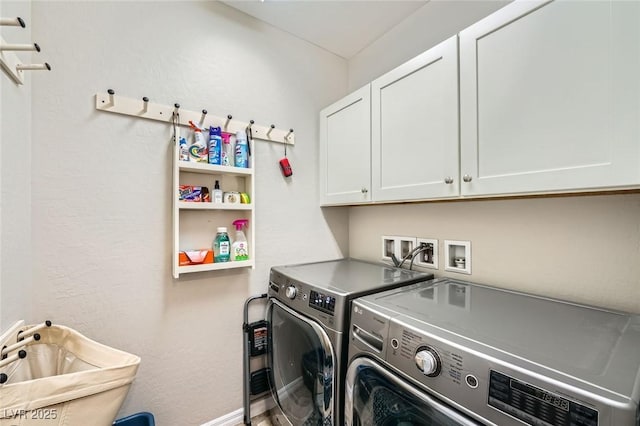 laundry area featuring cabinet space, washer and dryer, and baseboards