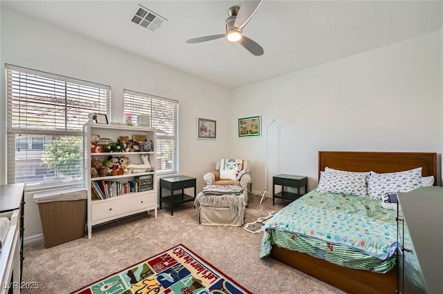 bedroom with carpet, multiple windows, a ceiling fan, and baseboards