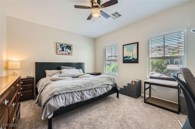 bedroom with light carpet, ceiling fan, and vaulted ceiling