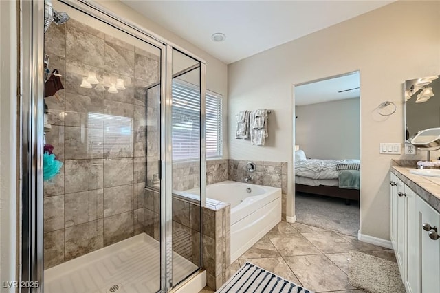 bathroom featuring ensuite bathroom, a shower stall, vanity, and a bath