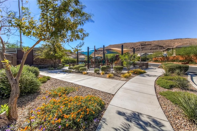 view of property's community with a playground