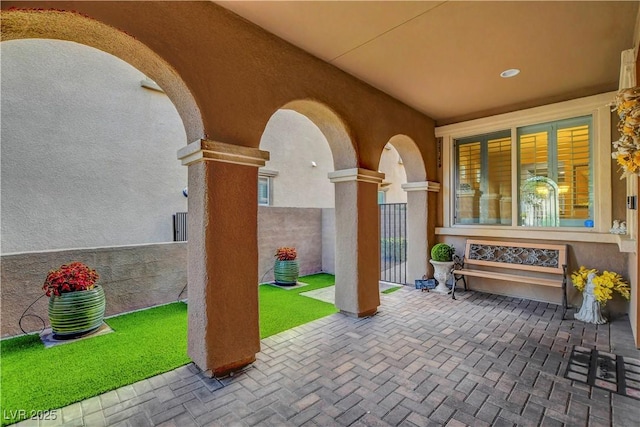 view of patio featuring fence