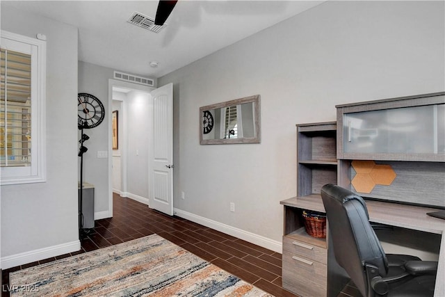 home office with baseboards, wood finish floors, and a ceiling fan