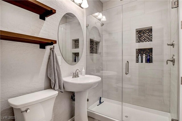 full bathroom with a stall shower and toilet