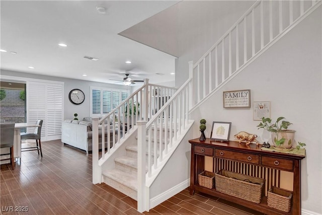 stairway with wood finished floors, ceiling fan, recessed lighting, and baseboards