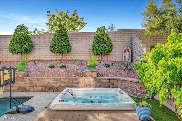 fenced backyard featuring a deck