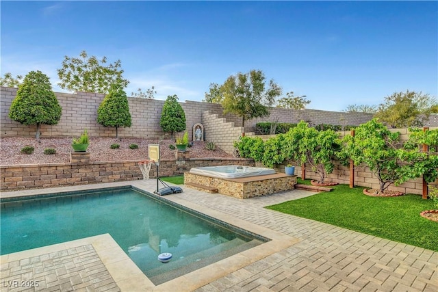 view of swimming pool with an outdoor hot tub, a fenced backyard, and a patio