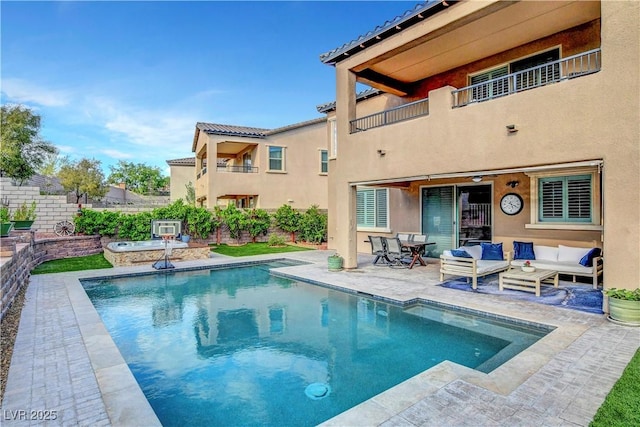 view of pool with a patio and outdoor lounge area