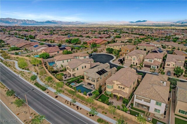 aerial view of residential area with a mountainous background