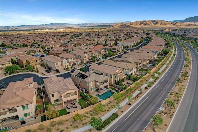 aerial view of residential area with a mountain backdrop