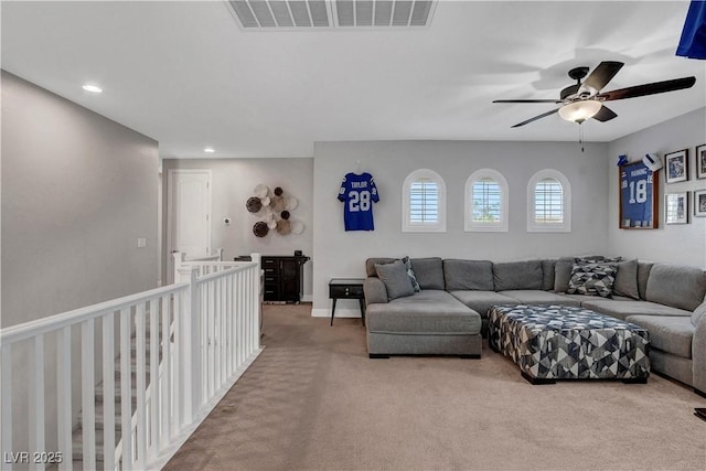 carpeted living area with ceiling fan, recessed lighting, and baseboards