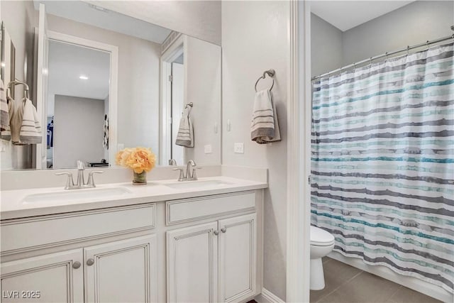 full bathroom featuring tile patterned flooring, toilet, double vanity, and a shower with shower curtain