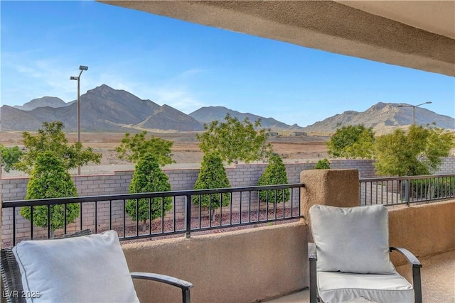 balcony featuring a mountain view