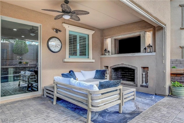 view of patio with an outdoor hangout area and a ceiling fan