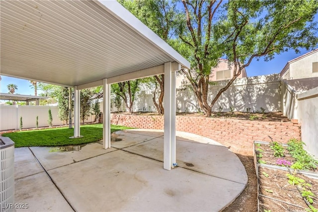 view of patio / terrace with a fenced backyard and central air condition unit