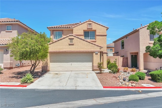 view of front facade with a tile roof, concrete driveway, stucco siding, fence, and a garage