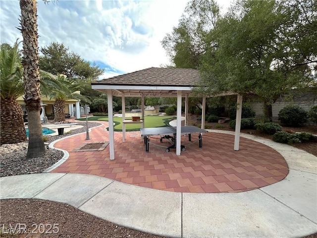 view of community with a gazebo, a patio, and a swimming pool