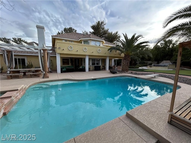 swimming pool featuring a patio area