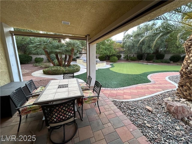 view of patio featuring outdoor dining area