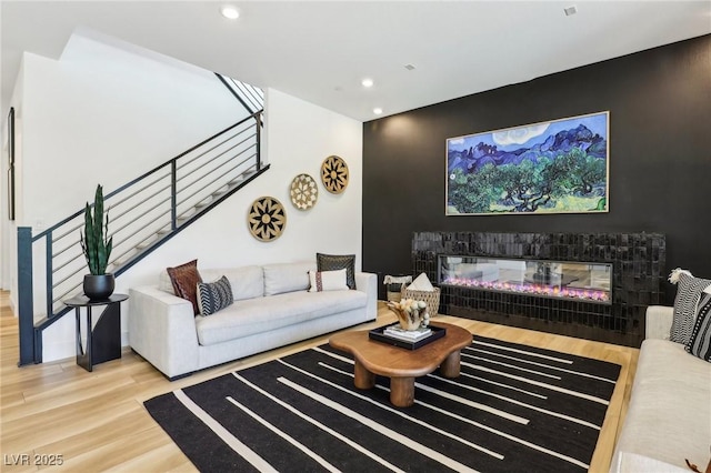 12155 Sage Thunder Ave, Las Vegas, NV 89138 - living area featuring stairs, wood finished floors, recessed lighting, and a multi sided fireplace