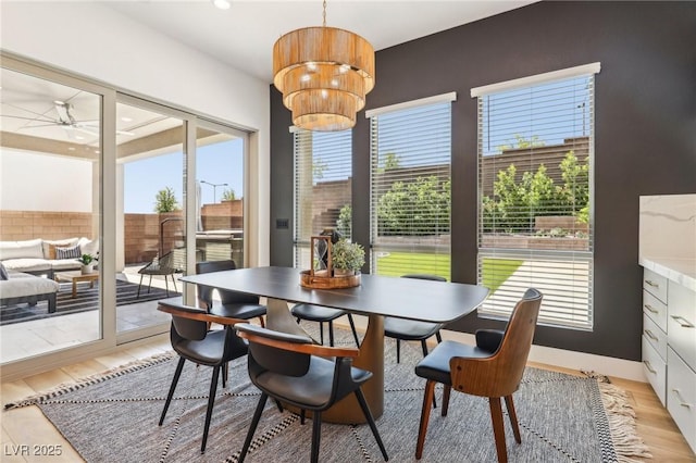 12155 Sage Thunder Ave, Las Vegas, NV 89138 - dining room with light wood finished floors, ceiling fan, a chandelier, and recessed lighting