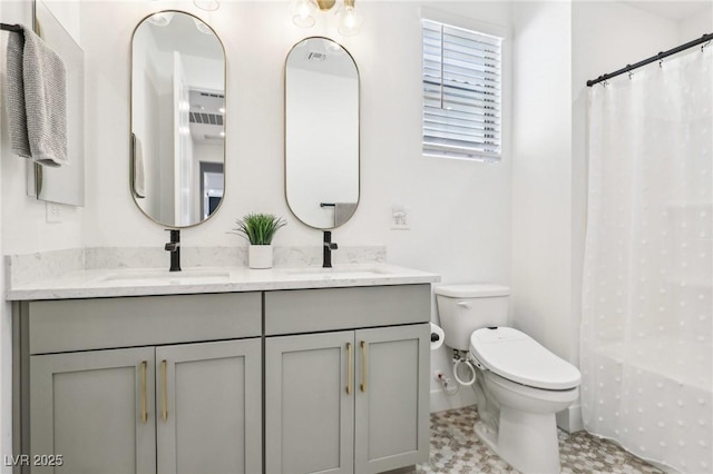 12155 Sage Thunder Ave, Las Vegas, NV 89138 - full bath with toilet, double vanity, curtained shower, and baseboards