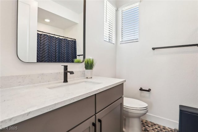 12155 Sage Thunder Ave, Las Vegas, NV 89138 - bathroom featuring vanity, toilet, and baseboards