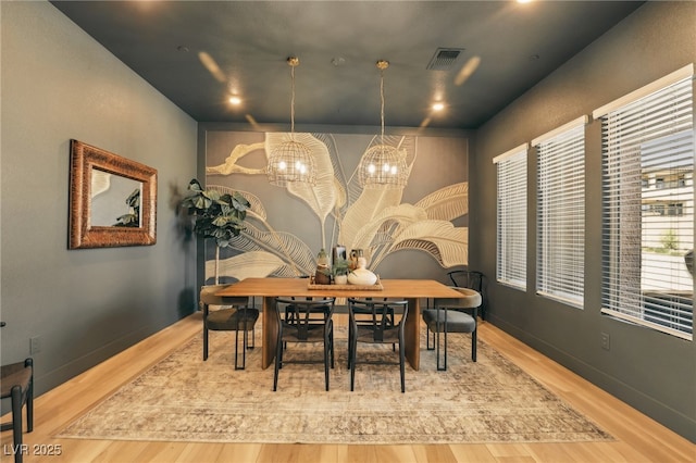 12155 Sage Thunder Ave, Las Vegas, NV 89138 - dining area featuring wood finished floors and a chandelier