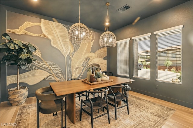 12155 Sage Thunder Ave, Las Vegas, NV 89138 - dining area with a chandelier and wood finished floors