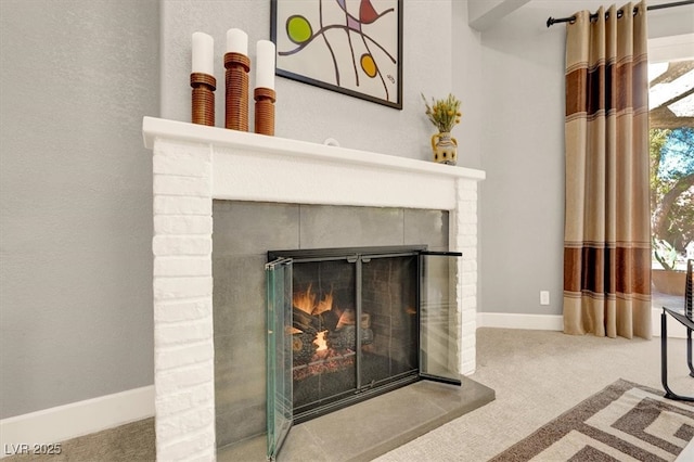5142 Southern Hills Ln, Las Vegas, NV 89113 - detailed view of carpet flooring, a glass covered fireplace, and baseboards