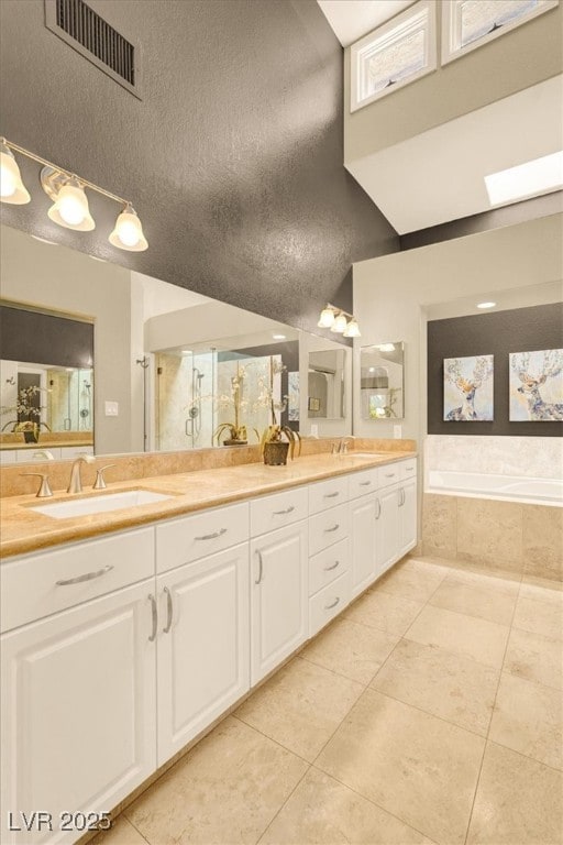 5142 Southern Hills Ln, Las Vegas, NV 89113 - full bath with tile patterned flooring, a garden tub, double vanity, and a shower with door