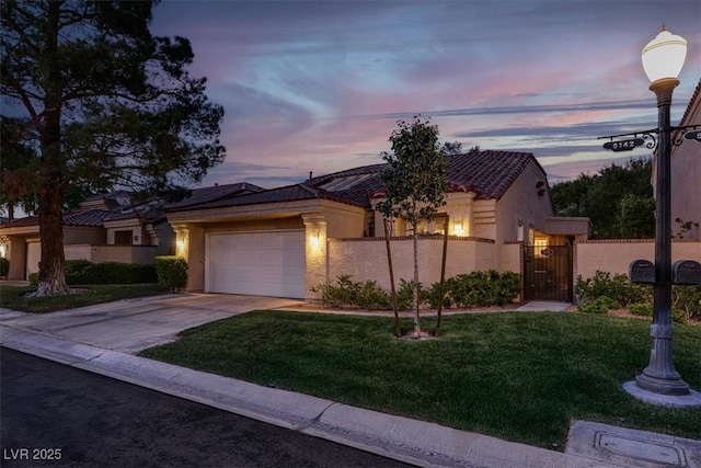 5142 Southern Hills Ln, Las Vegas, NV 89113 - view of front of home featuring a tiled roof, an attached garage, driveway, stucco siding, and a gate