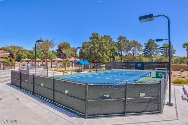5142 Southern Hills Ln, Las Vegas, NV 89113 - view of tennis court with fence