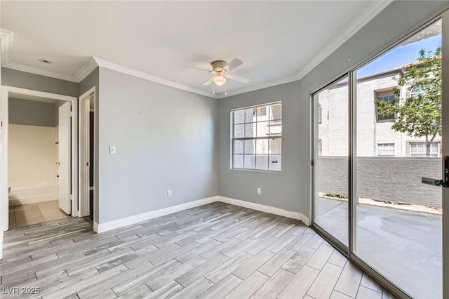 unfurnished room with ceiling fan, baseboards, light wood-style floors, and crown molding
