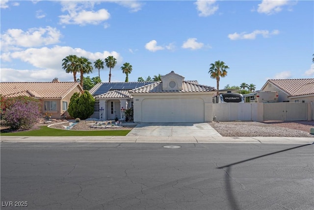 4644 Canna Dr, Las Vegas, NV 89122 - view of front of house featuring a garage, driveway, stucco siding, and a tile roof