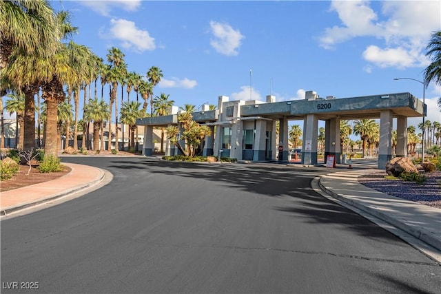 4644 Canna Dr, Las Vegas, NV 89122 - view of asphalt street featuring sidewalks, curbs, and street lights