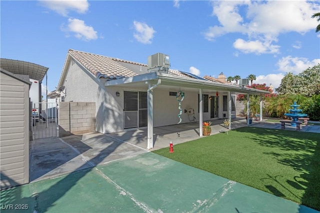 4644 Canna Dr, Las Vegas, NV 89122 - back of property featuring stucco siding, a patio area, and a gate