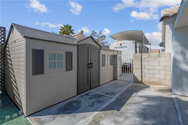 4644 Canna Dr, Las Vegas, NV 89122 - view of shed featuring a gate and fence