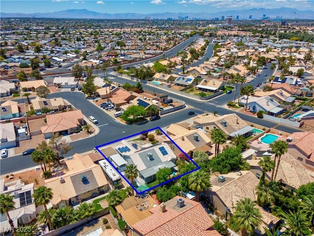 4644 Canna Dr, Las Vegas, NV 89122 - aerial view of residential area featuring property parcel outlined and a mountainous background