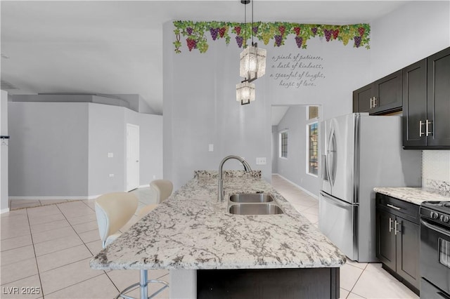 4644 Canna Dr, Las Vegas, NV 89122 - kitchen with a sink, black range with electric stovetop, light tile patterned floors, and a breakfast bar area