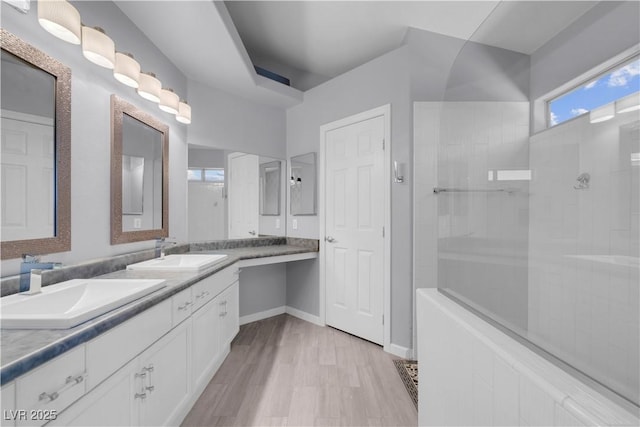 4644 Canna Dr, Las Vegas, NV 89122 - bathroom with walk in shower, wood finished floors, and double vanity